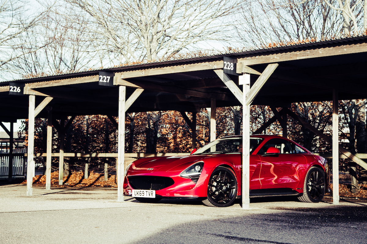 Side view of Griffith parked in garage at Goodwood Motor Circuit